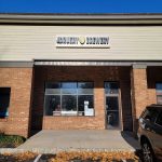 Brewery storefront with "Druery Brewery" sign, brick facade, and large windows.